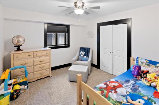 Generously sized upper-level bedroom with ample natural light and flexible use.