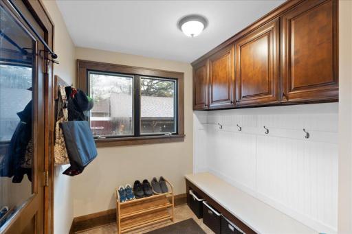 Functional mudroom/drop zone with built-in bench, upper cabinetry, and dedicated storageâperfect for everyday organization.