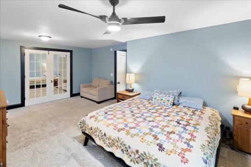 Primary suite with dedicated sitting area and direct access to additional living space.
