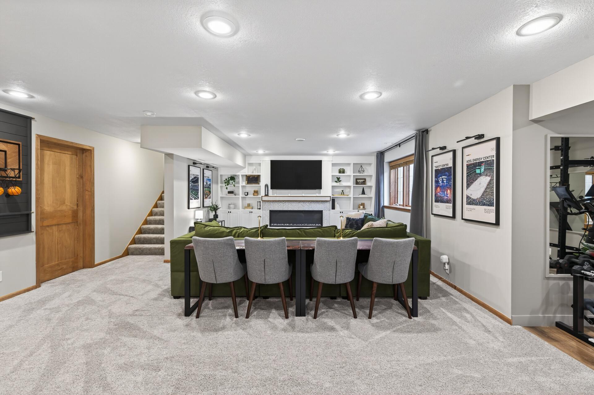 Fully finished lower level with expansive family room, built-ins, and electric fireplace.