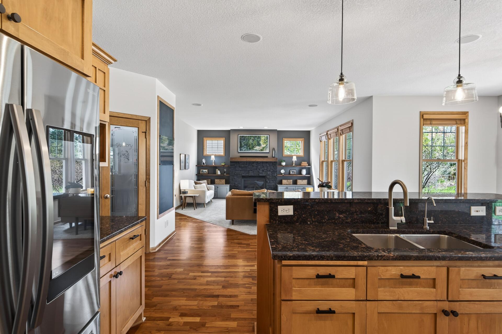 Bright and open kitchen with generous storage, center island, and easy connection to dining and living areas.