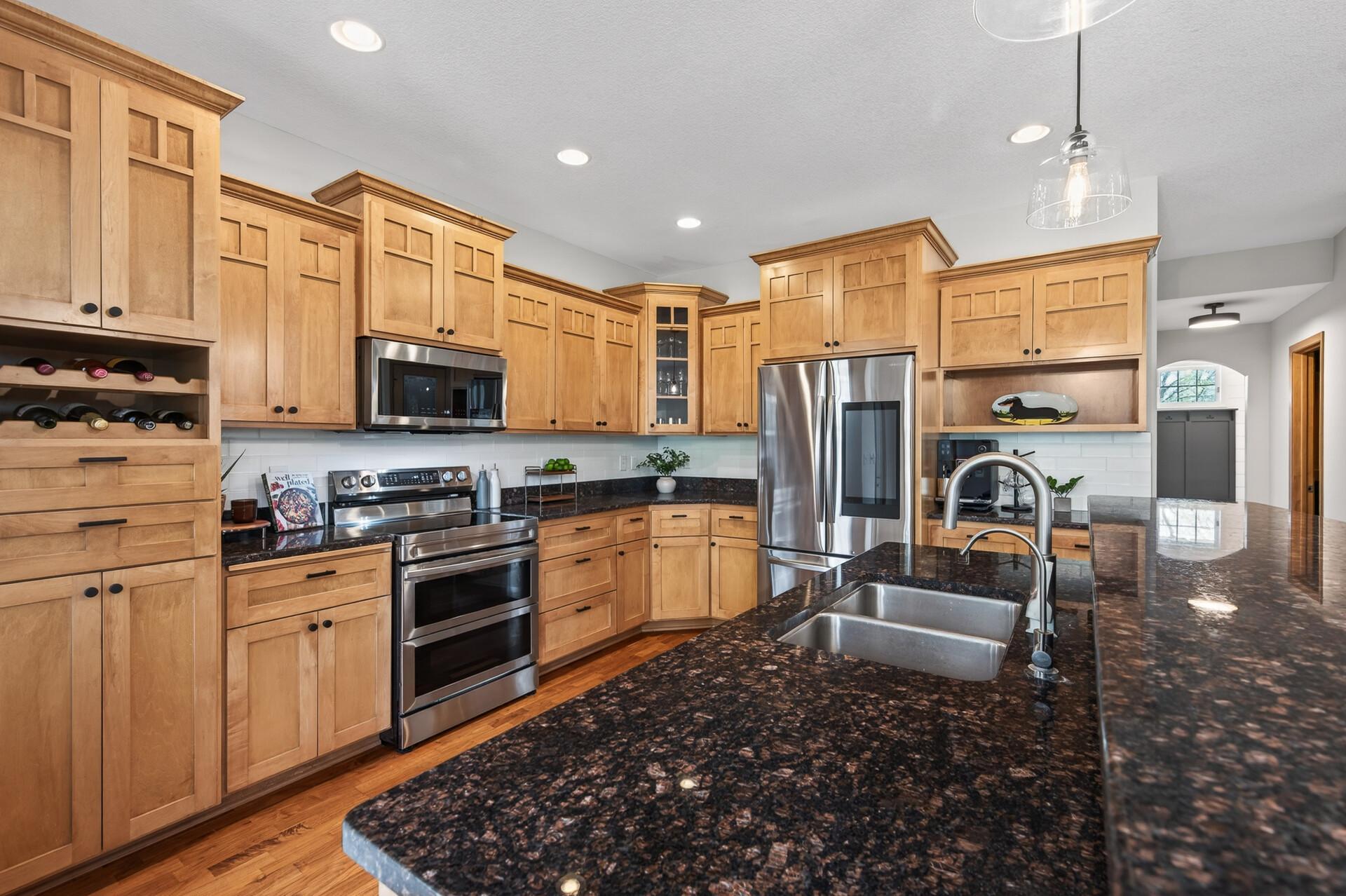 Bright and open kitchen with generous storage, center island, and easy connection to dining and living areas.