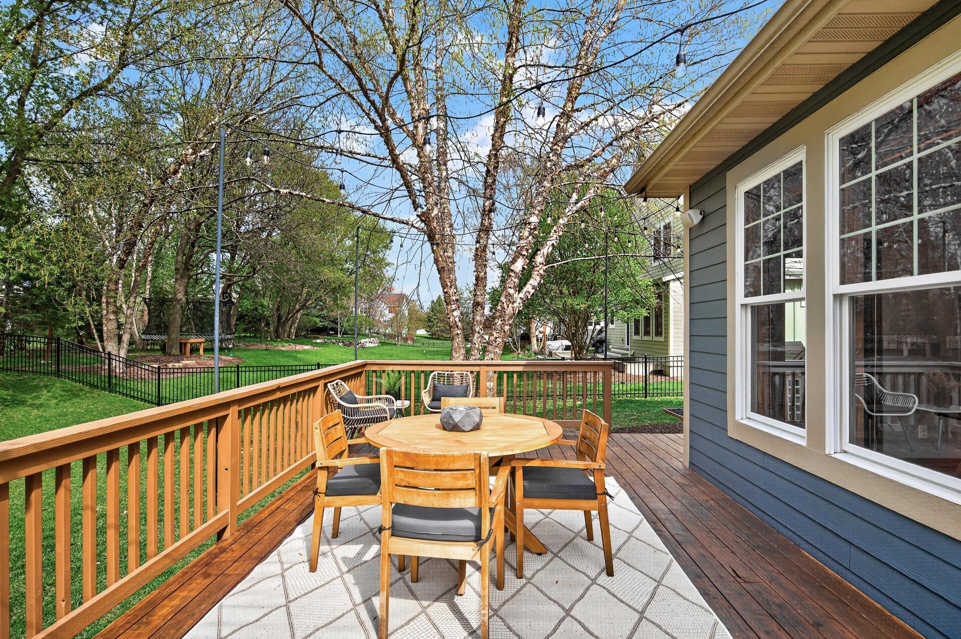 Spacious deck overlooking a fully fenced backyard—perfect for relaxing or entertaining.
