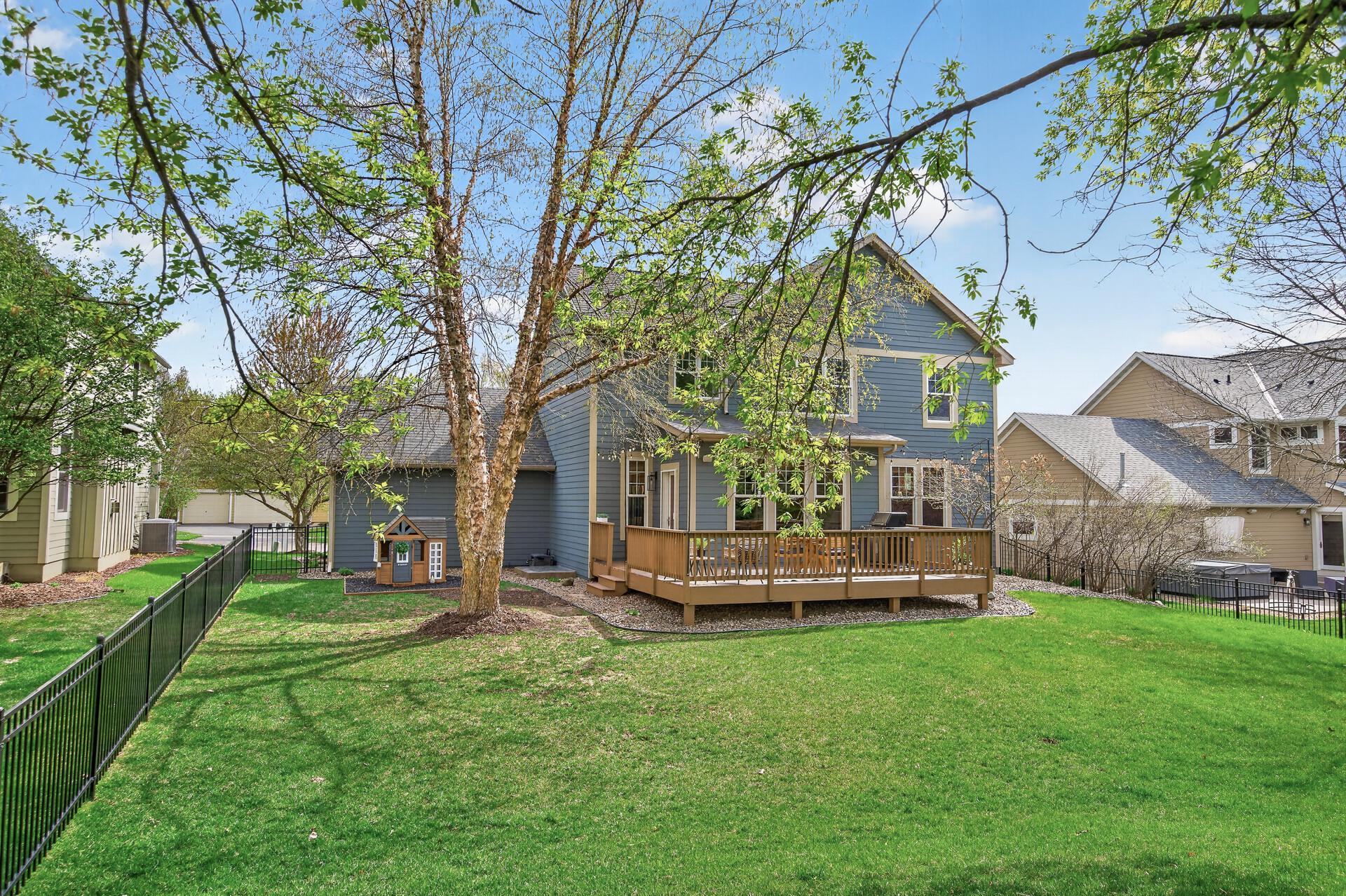 Great outdoor space featuring a deck and fully fenced yard ideal for play, pets, and gatherings.