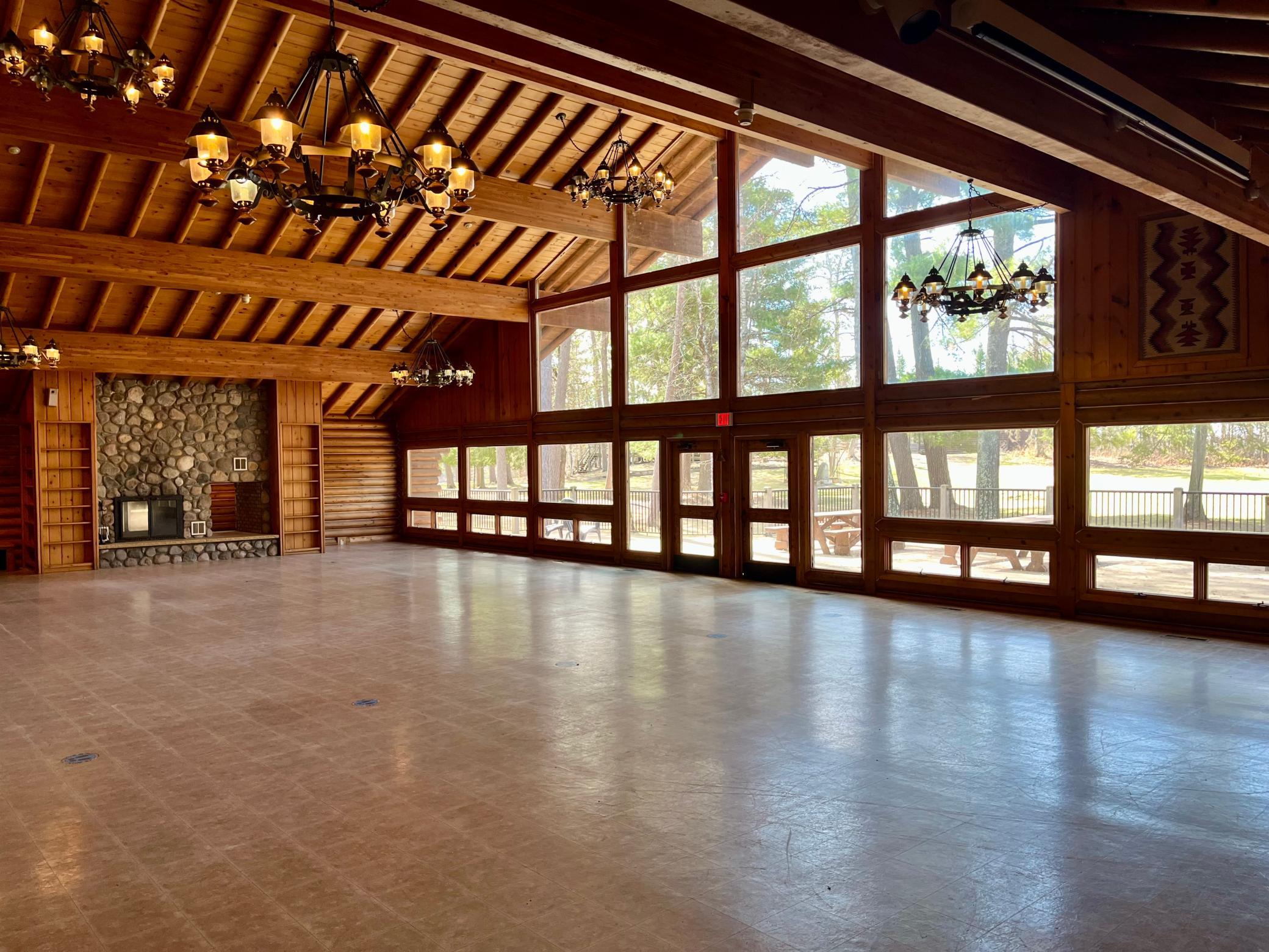 Wall of windows with views of towering pines!