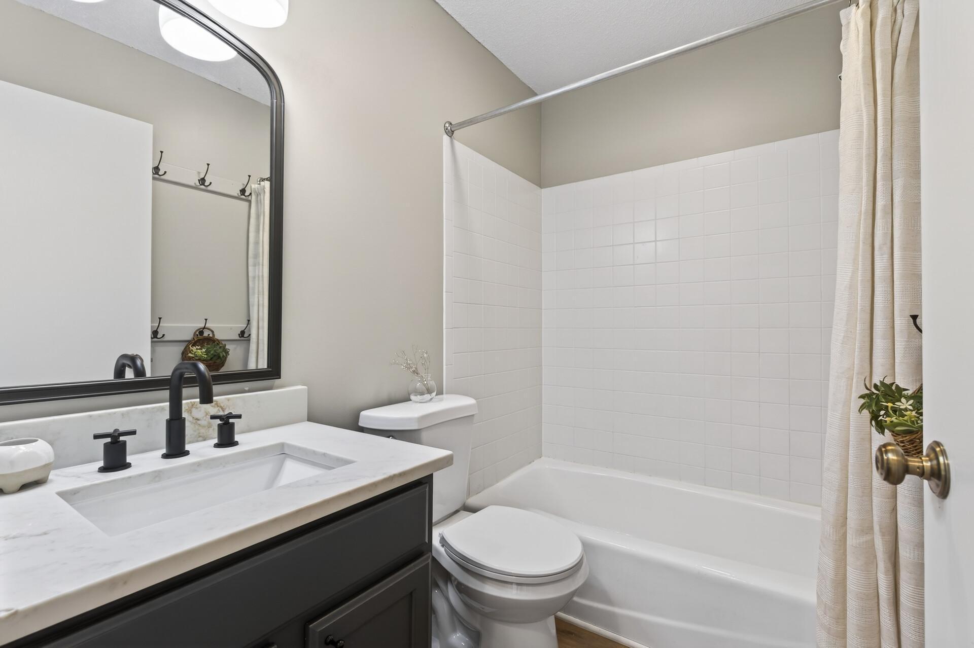 Full Bathroom upper, new vanity, new mirror, new toilet, new lighting