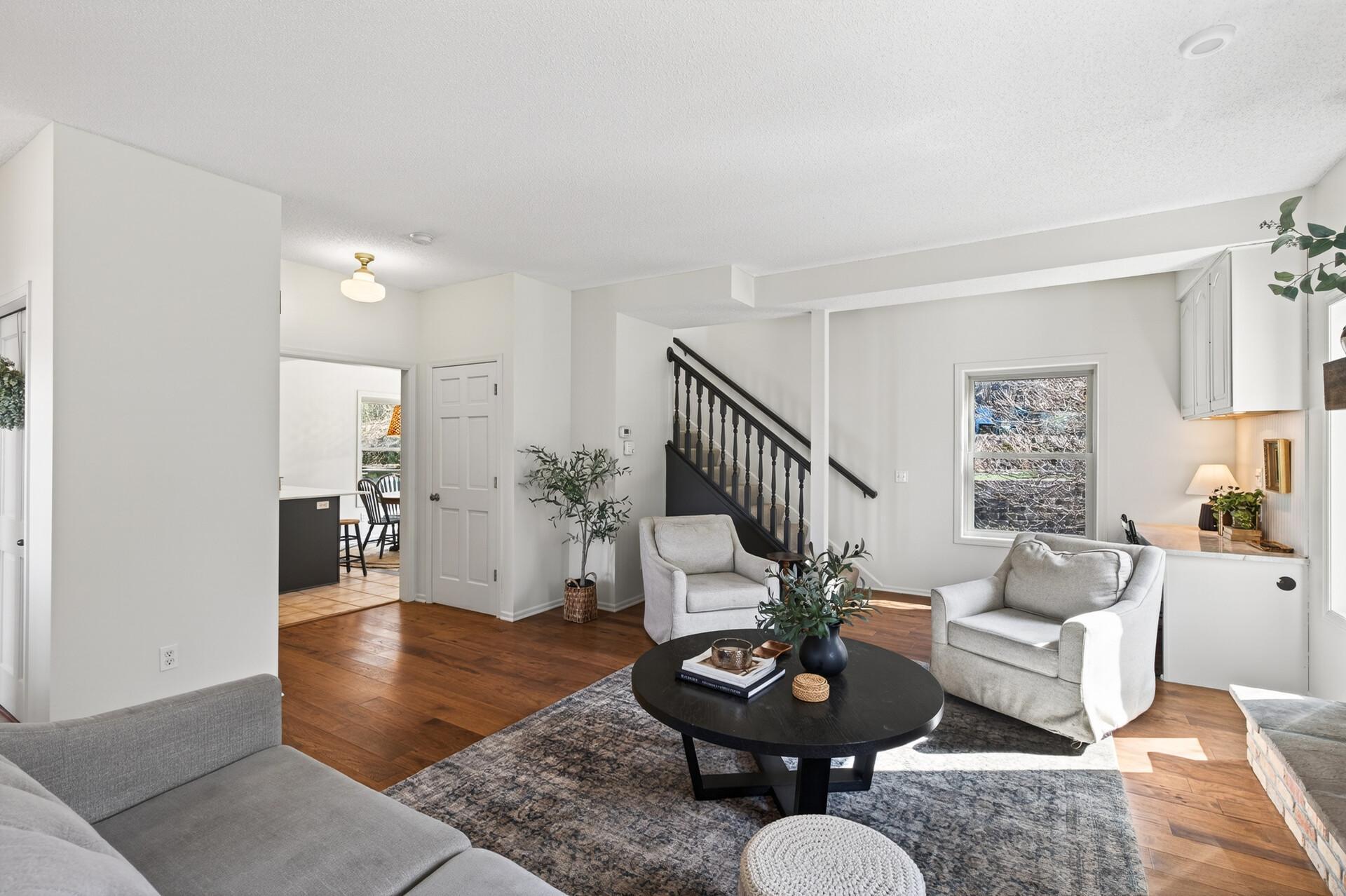 LR, opening to Kitchen, stairs to Upper level