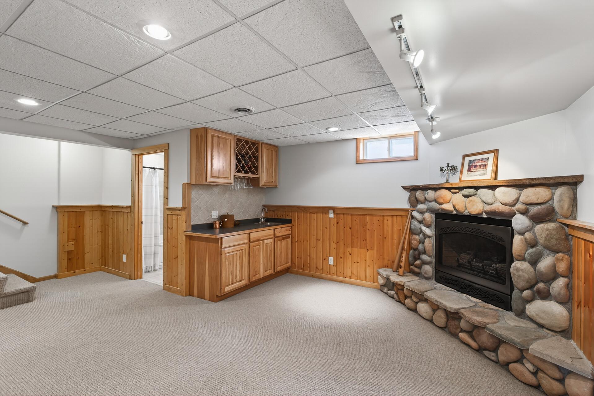 Wet Bar & sink, new lighting, gas stone Fireplace