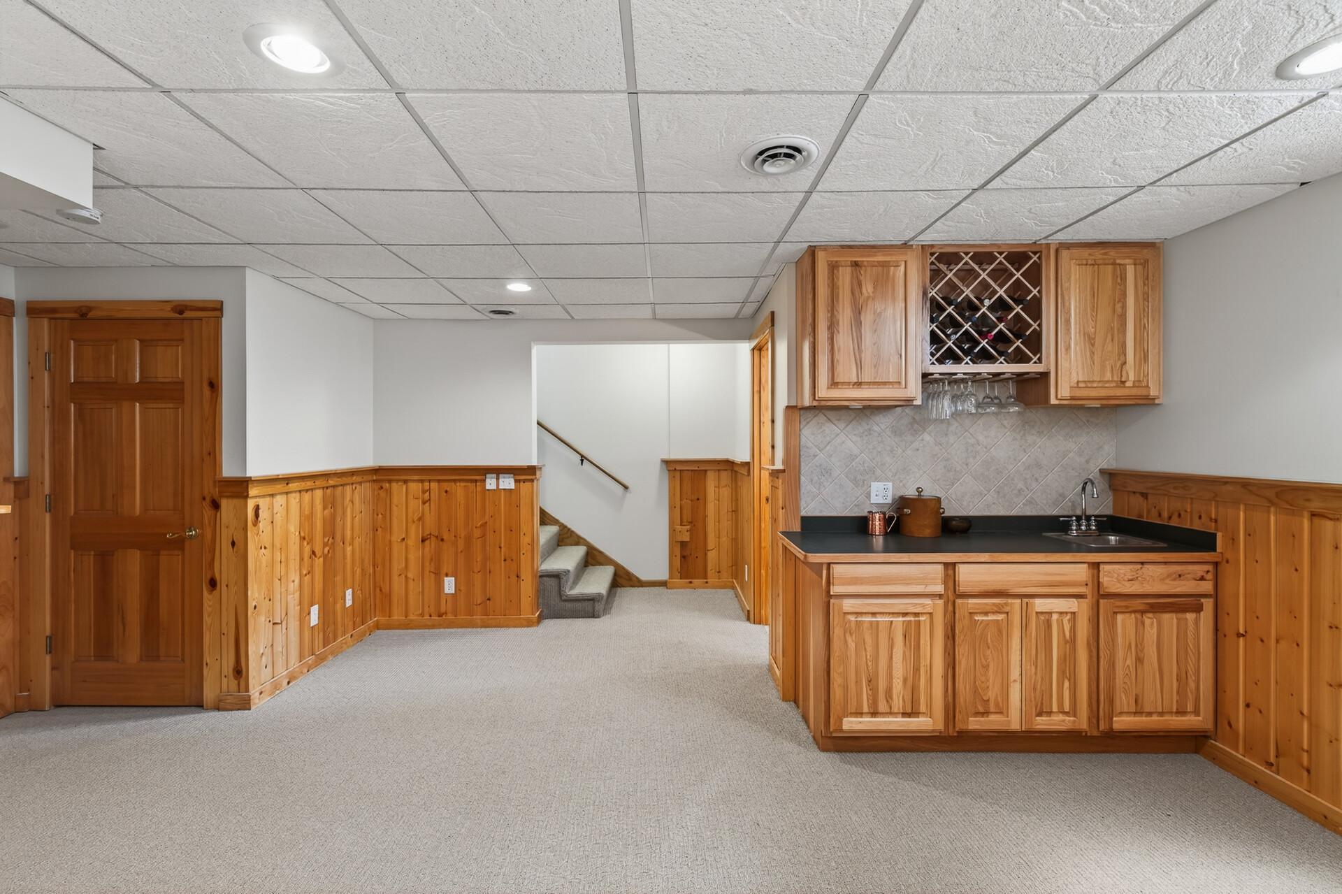 Lower level, storage under stairs, Wine Cabinet & storage