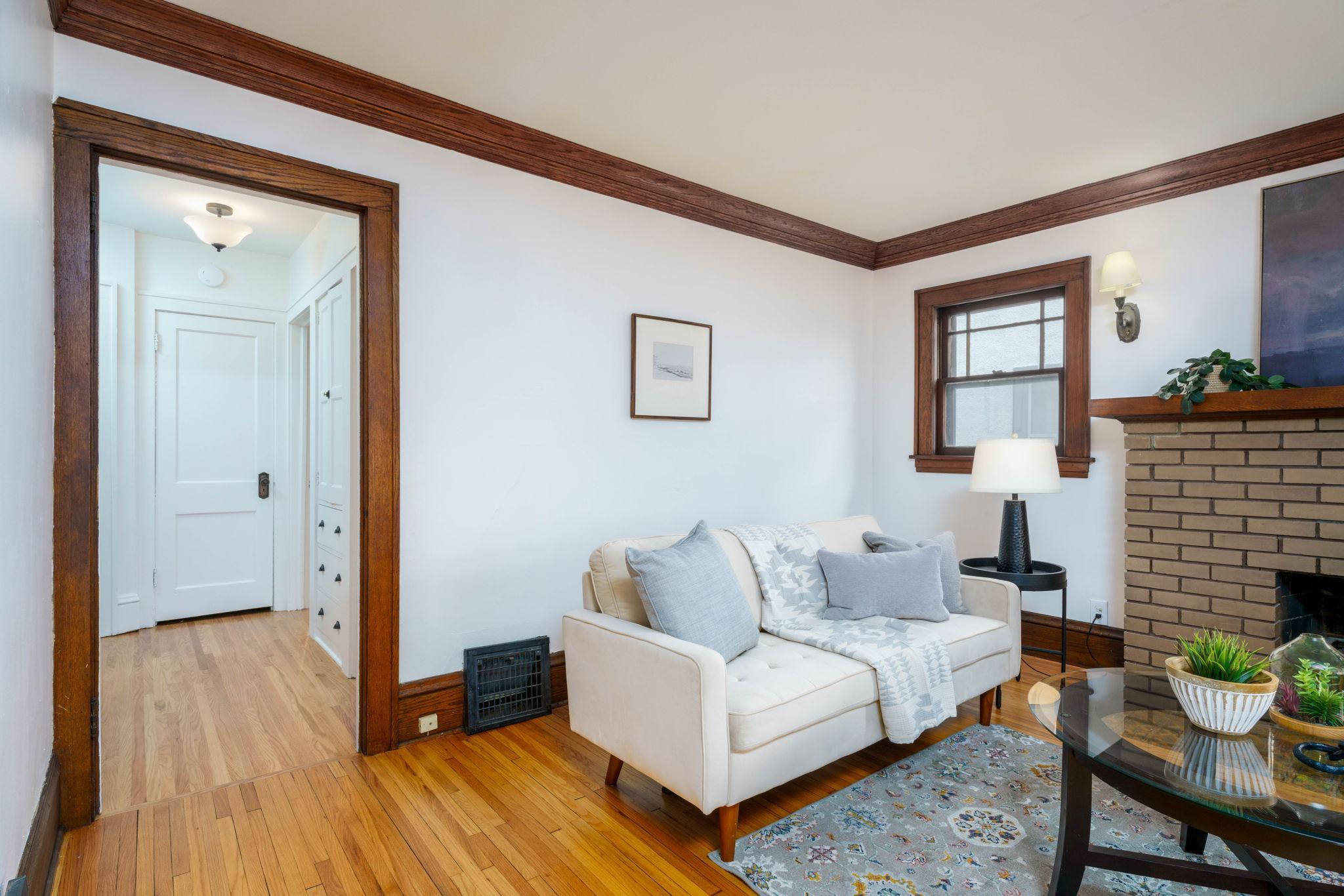 View of the living room looking into the hallway, showcasing the home's natural flow and layout.