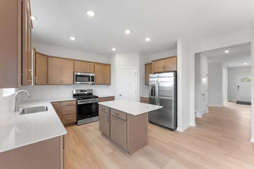 Kitchen - Stainless Steel appliances, ceramic tile backsplash and quartz countertops