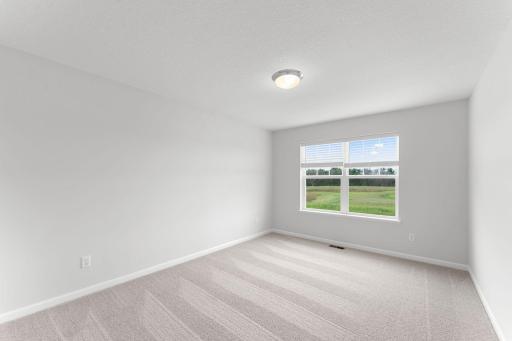The home features three additional bedrooms alongside the owner’s suite, all equipped with walk-in closets.