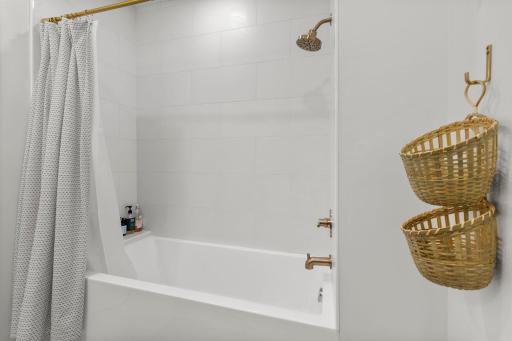 Lower level bathtub/shower with ceramic tile tub surround!