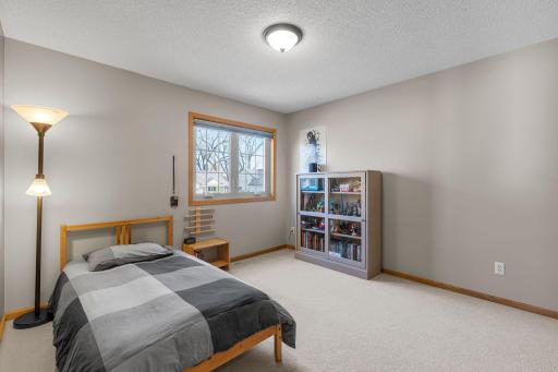Third bedroom on upper level with plush carpeting and six panel doors throughout!