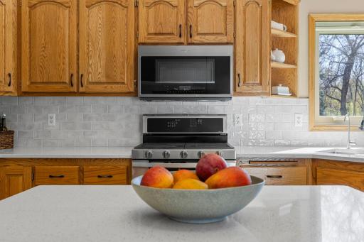 Gleaming quartz countertops throughout the kitchen (new in 2022).