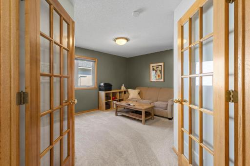 Main level bedroom with french doors, and newer carpeting!
