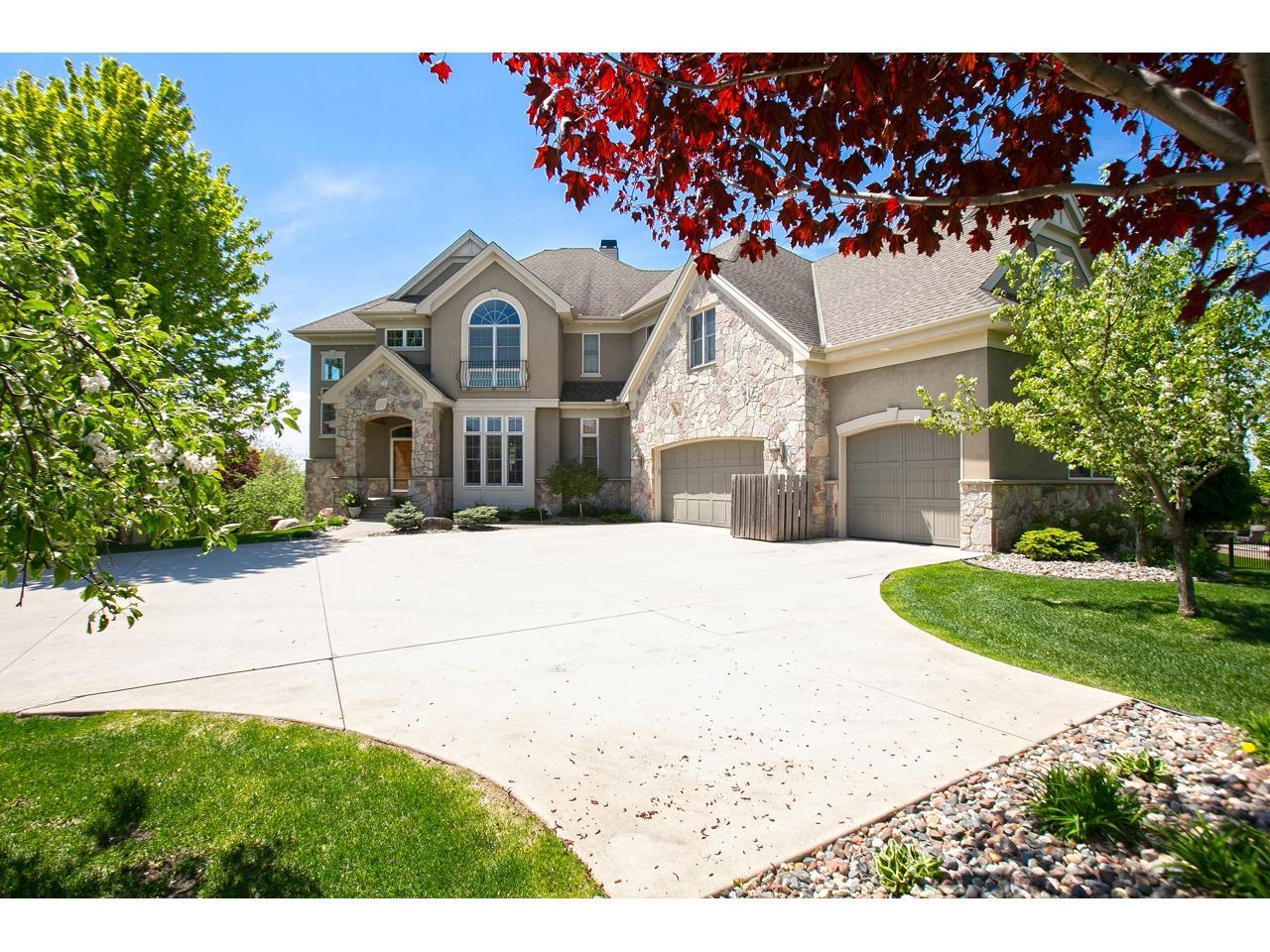 Custom two-story by Wooddale Builders with unparalleled south-facing views overlooking the Minnesota River Valley.