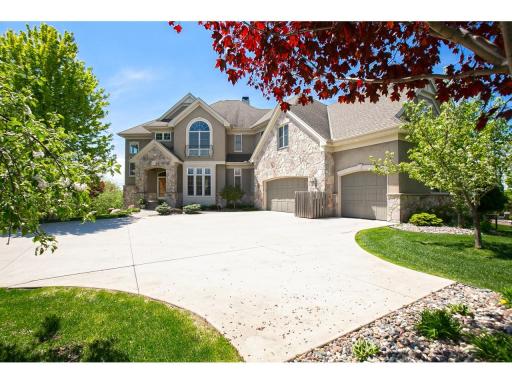 Custom two-story by Wooddale Builders with unparalleled south-facing views overlooking the Minnesota River Valley.