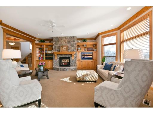 Cozy up to the two sided stone fireplace