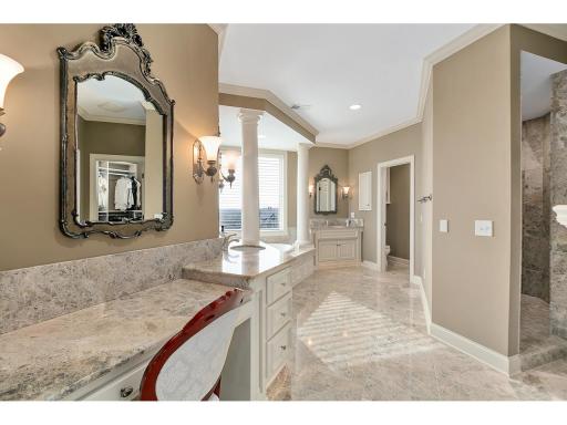 Spa like primary bath with makeup station, jetted soaking tub, separate water closet, walk in shower and oversized closet!