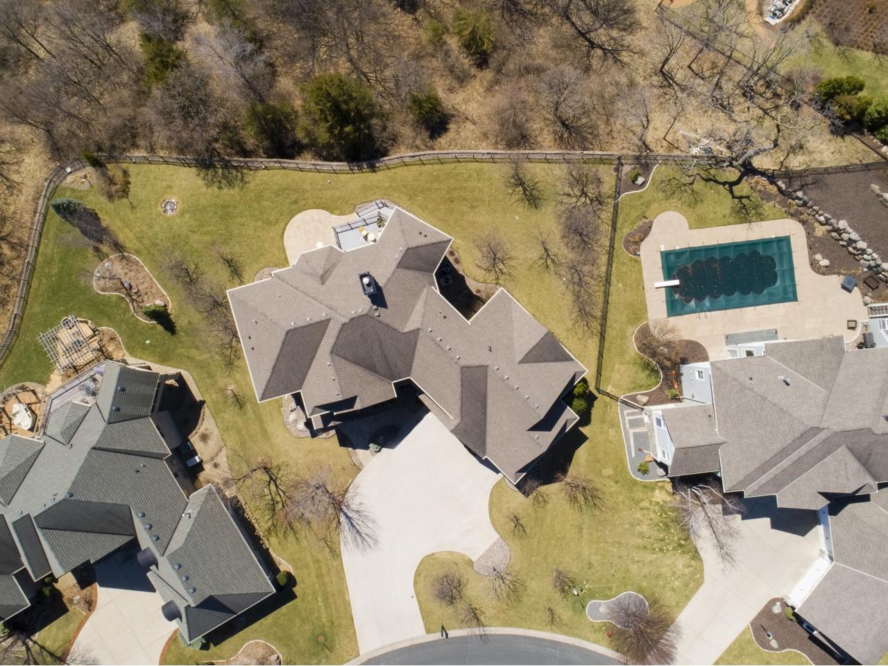 Perfectly designed with over 7,000 finished sqft boasting 6 bedrooms, 5 bathrooms, large living & entertaining spaces, gourmet kitchen with all of the extras, main floor executive style office and much more!
