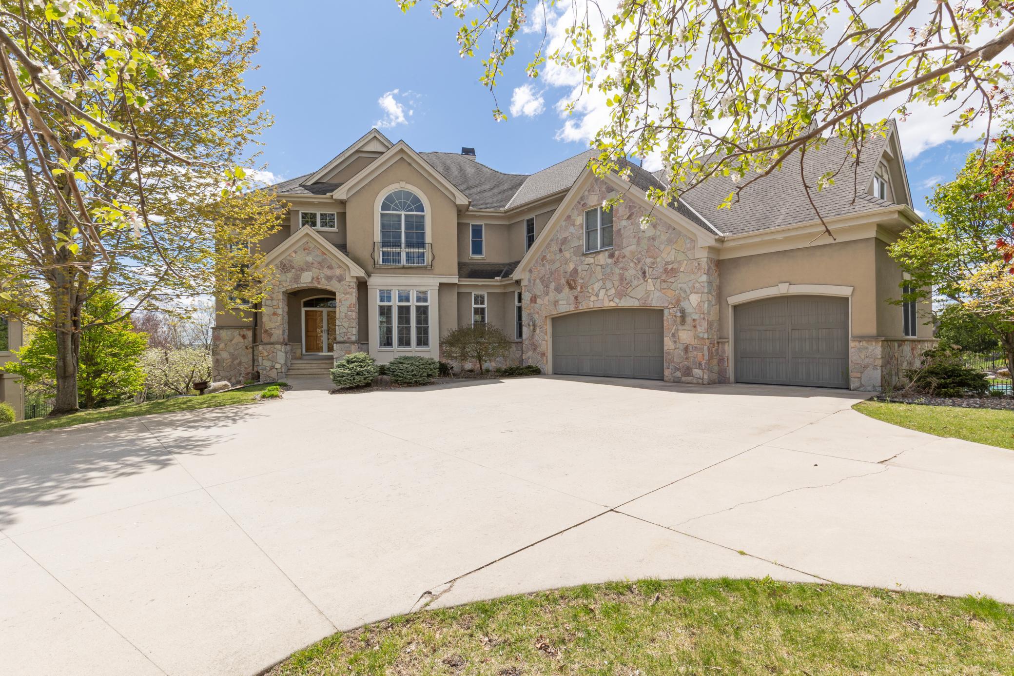 Custom two-story by Wooddale Builders with unparalleled south-facing views overlooking the Minnesota River Valley.