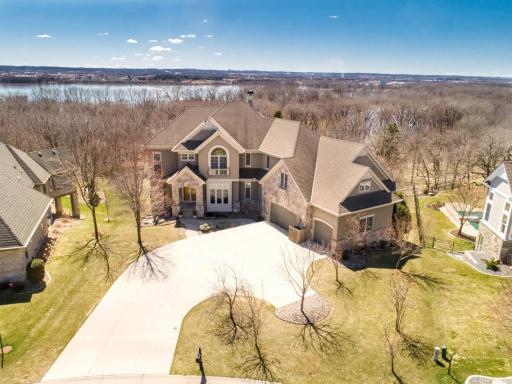 Custom two-story by Wooddale Builders with unparalleled south-facing views overlooking the Minnesota River Valley.