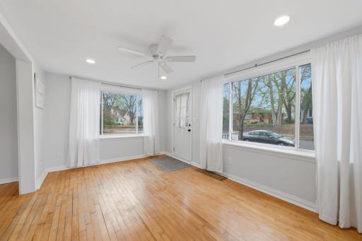 Large windows bring in the light and makes this living room shine.