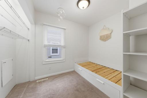 Bedroom off of the dining room, bed is built in and staying with home.