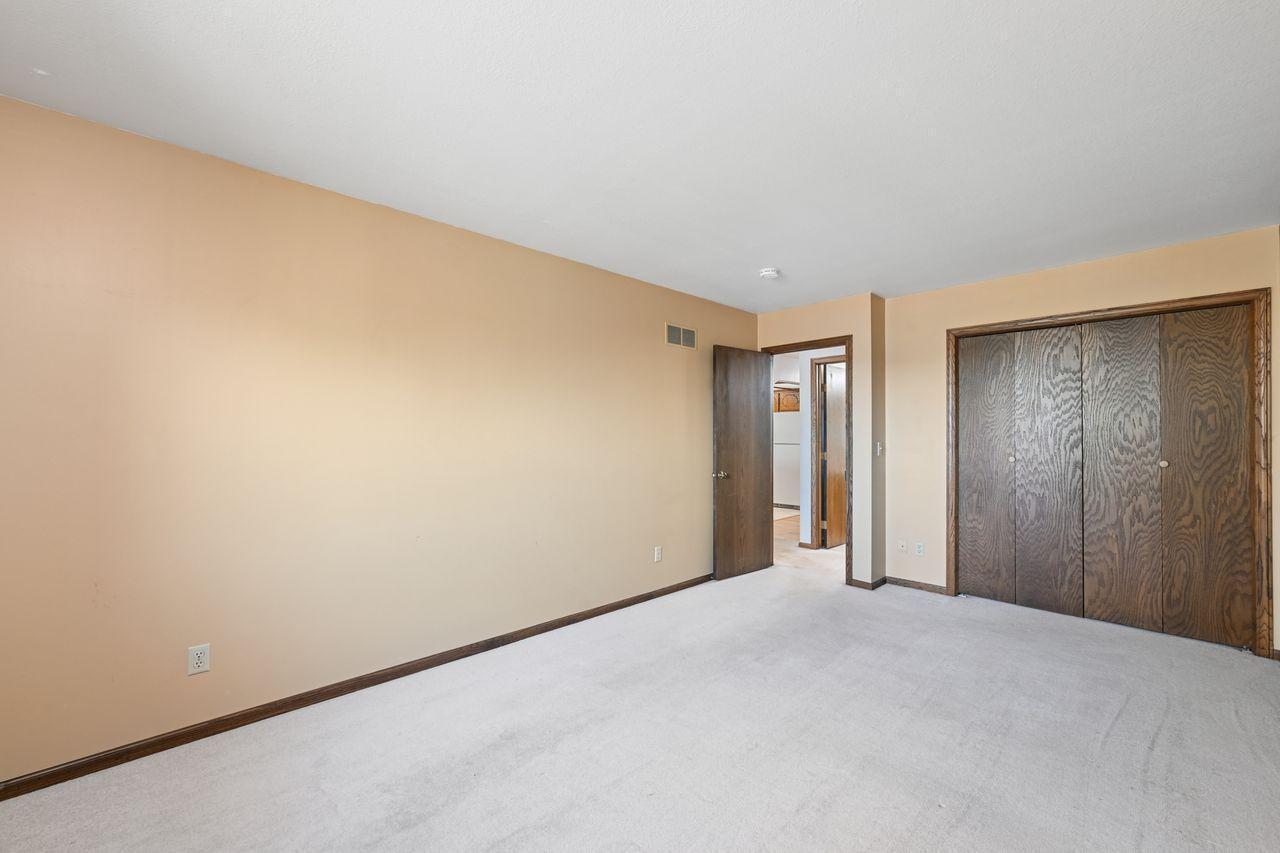 Another view of the primary bedroom