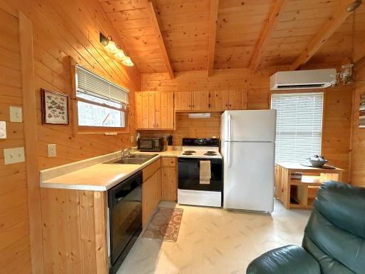 Efficient kitchen with window view to lake.