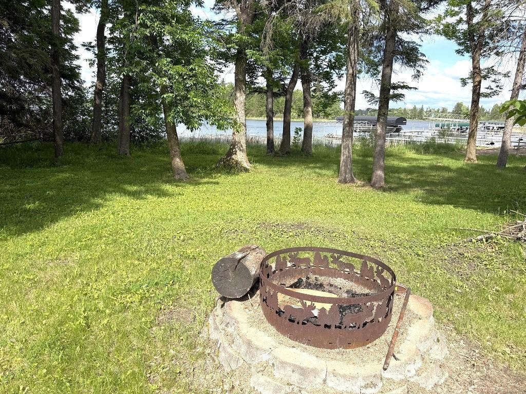 Fire pit in front of cabin.