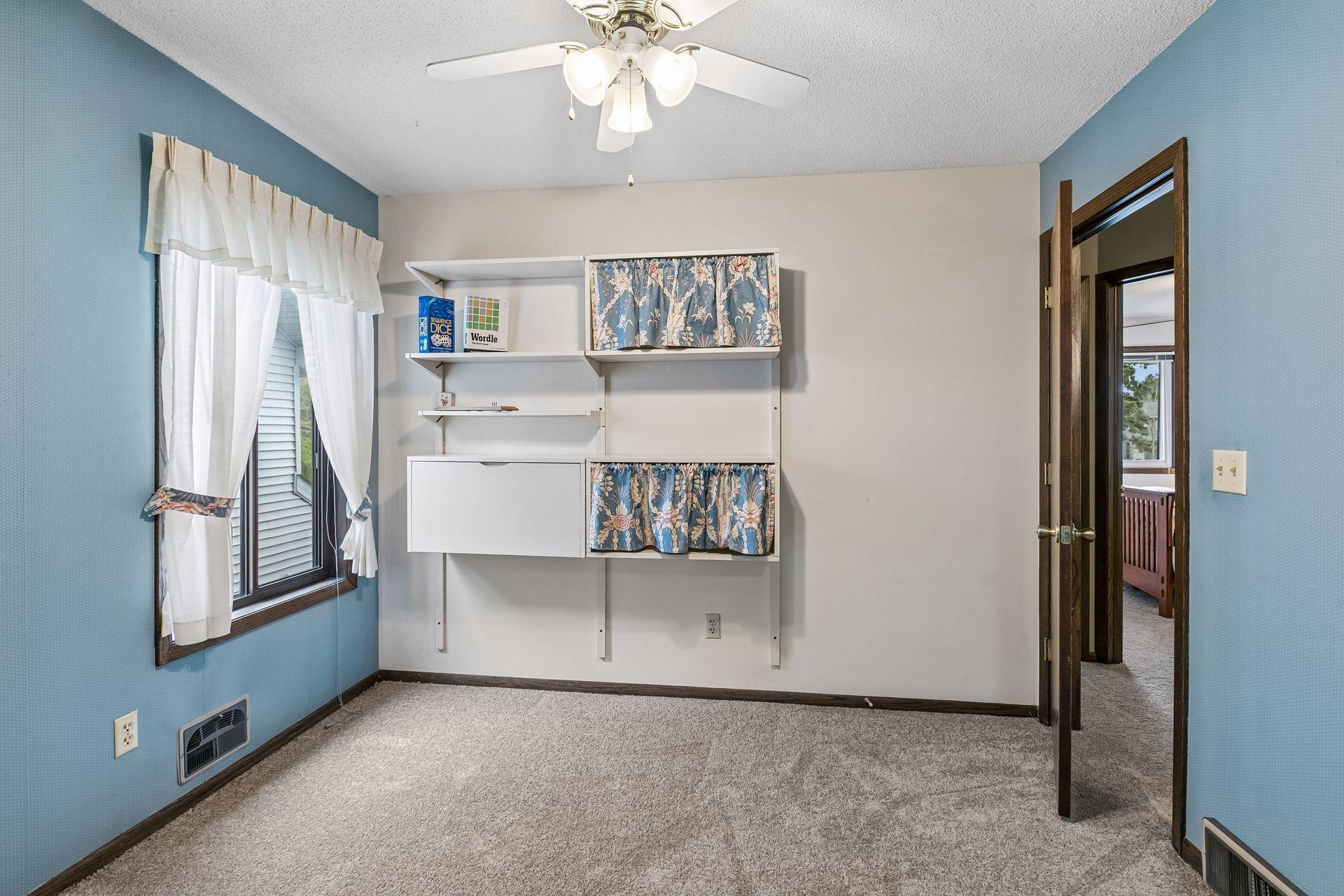 This room also has a great closet and built in shelving.
