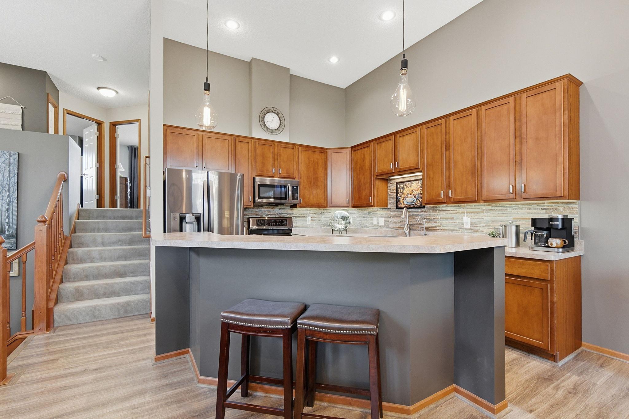 An oversized island offers additional seating for informal dining.