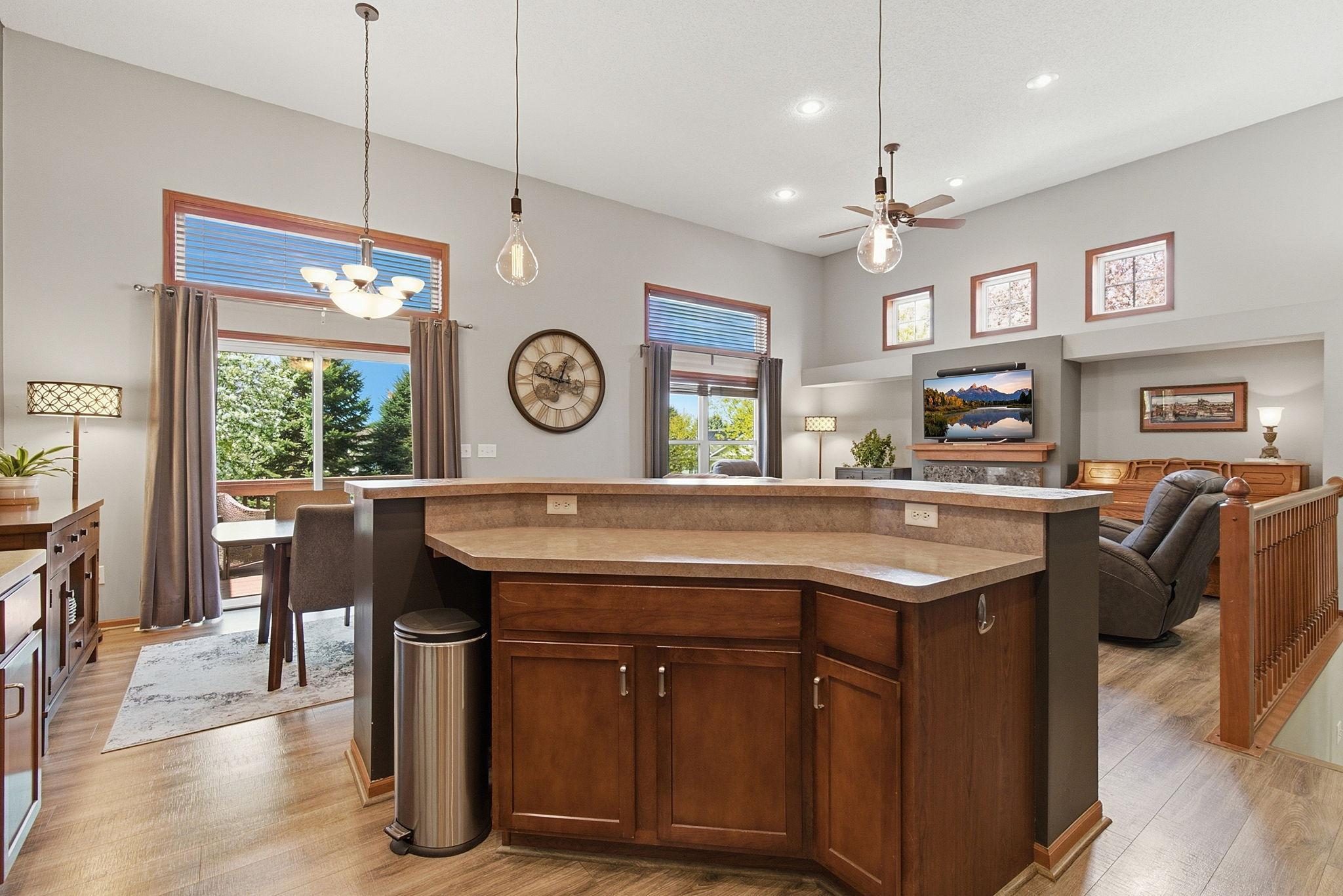 A large center island with storage is a great place to enjoy conversation and nature views.