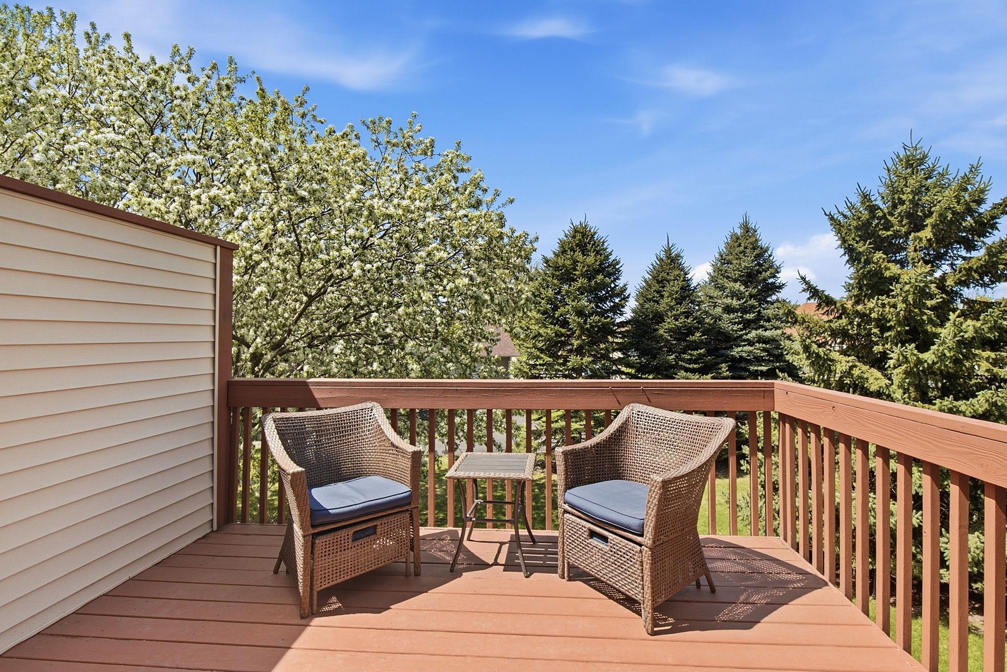 The private Deck overlooks a stand of trees and beautiful greenspace-perfect for birdwatching or just relaxing!