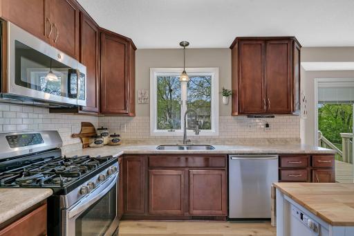 Large kitchen featuring stainless steel appliances