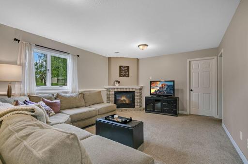 The downstairs family room with a gas fireplace perfect for cozy nights in!
