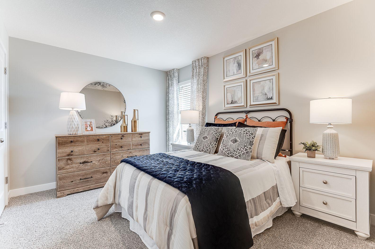 The private junior suite is tucked to the side and is a perfect space for your home office, guest room, or bedroom for one who needs a little additional privacy. (Model photo, colors may vary.)