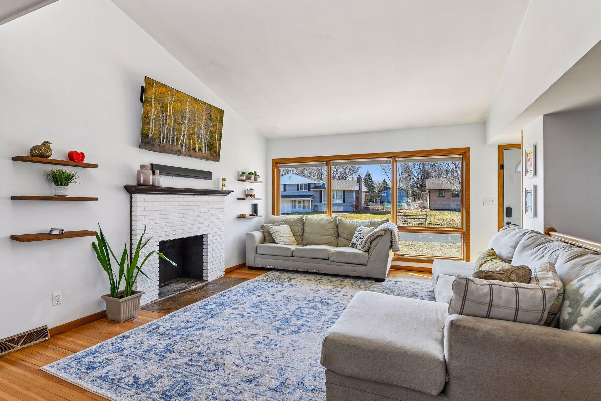 Floor to ceiling windows in the living room allows for abundance of natural light