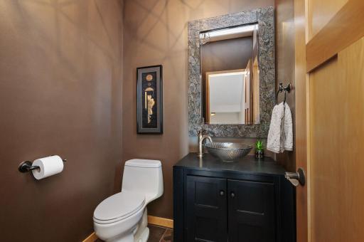 Main level guest bath with designer since and paneled doors