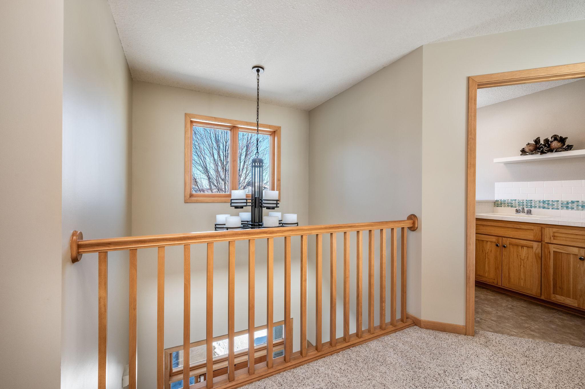 Upper-level laundry with cabinet and laundry sink