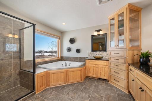 The primary bath features separate shower and whirlpool tub. Additionally, you have built-ins and separate designer sinks. The picture says it all!