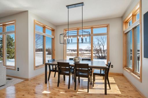 Informal dining area with the updated light fixture and gorgeous Hickory floors