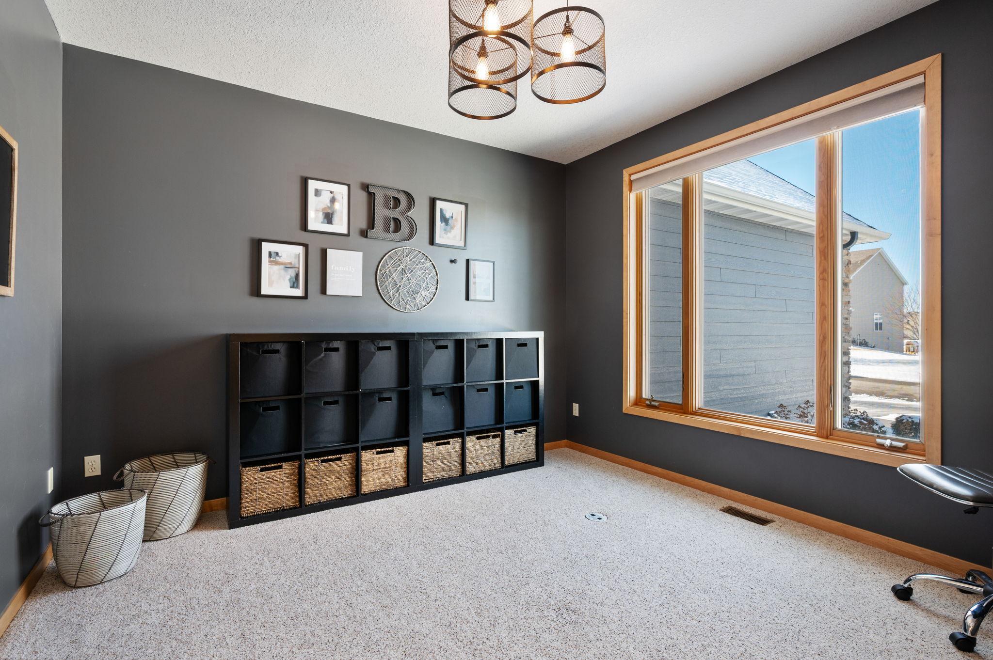 Adjacent to the front door is a main floor office or this is also a perfect kid's room which this is what this family used it for. Note: there is an outlet approximately 2 ft from the windows to place a desk