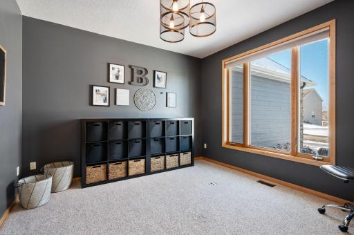 Adjacent to the front door is a main floor office or this is also a perfect kid's room which this is what this family used it for. Note: there is an outlet approximately 2 ft from the windows to place a desk