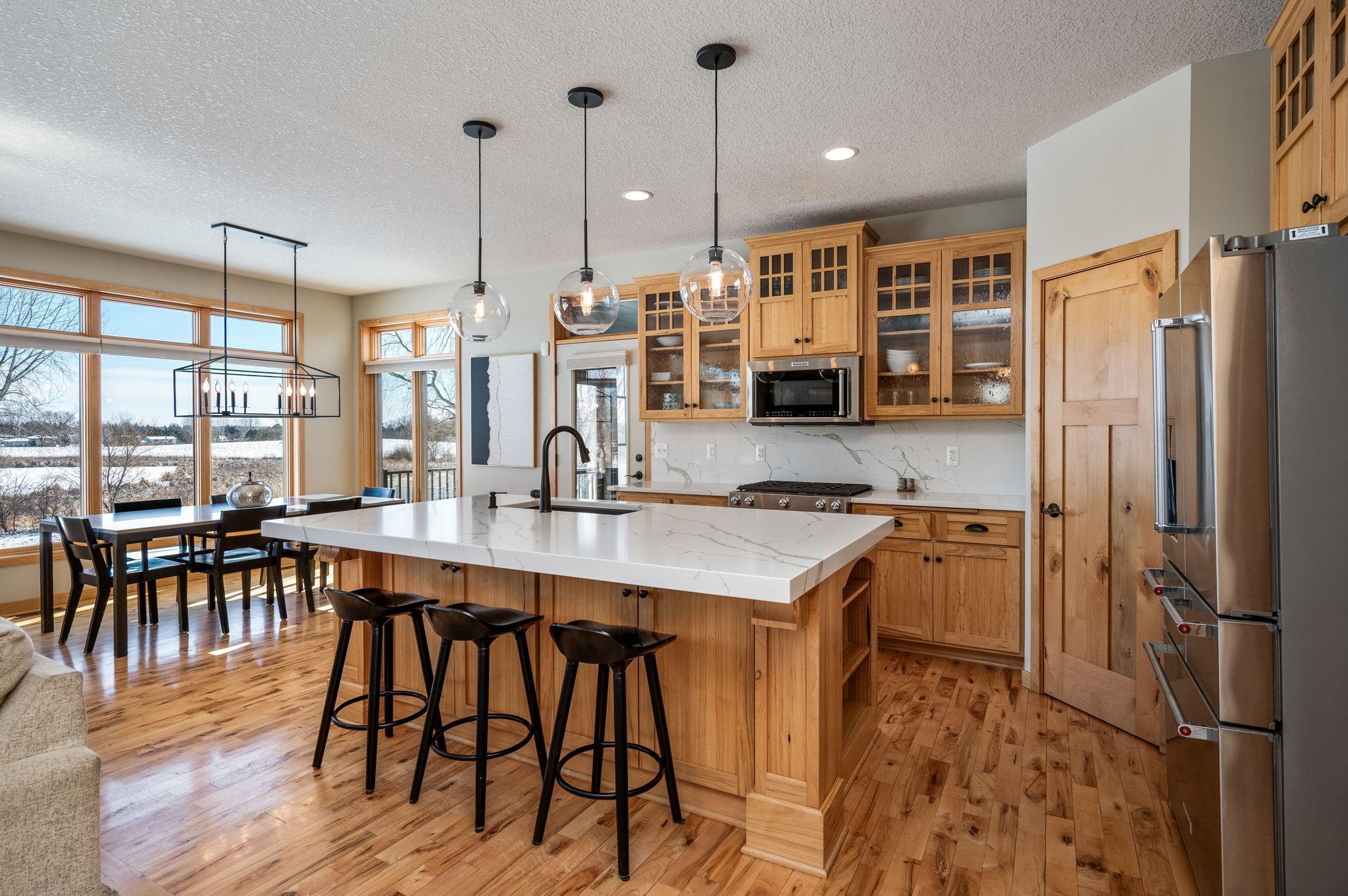 The island seats 4 comfortably and the dining area sits separately with all the surrounding views