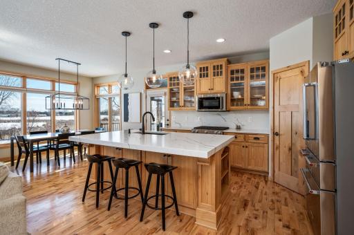 The island seats 4 comfortably and the dining area sits separately with all the surrounding views