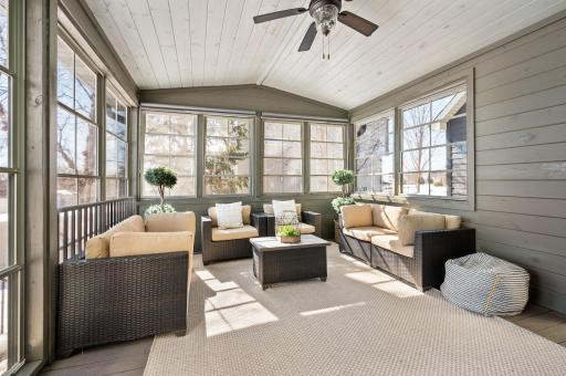 Vaulted 3 season porch is a great place to entertain and just enjoy! The door leading to the backyard does have room for your grill and steps to the backyard