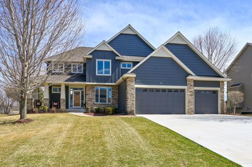 Custom built home that is west facing and 3 car wide cement driveway